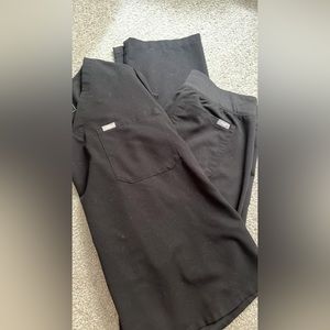 Set of figs scrubs black in color size medium. Barely worn